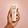 Verlou Luxe foundation held against a soft rose background