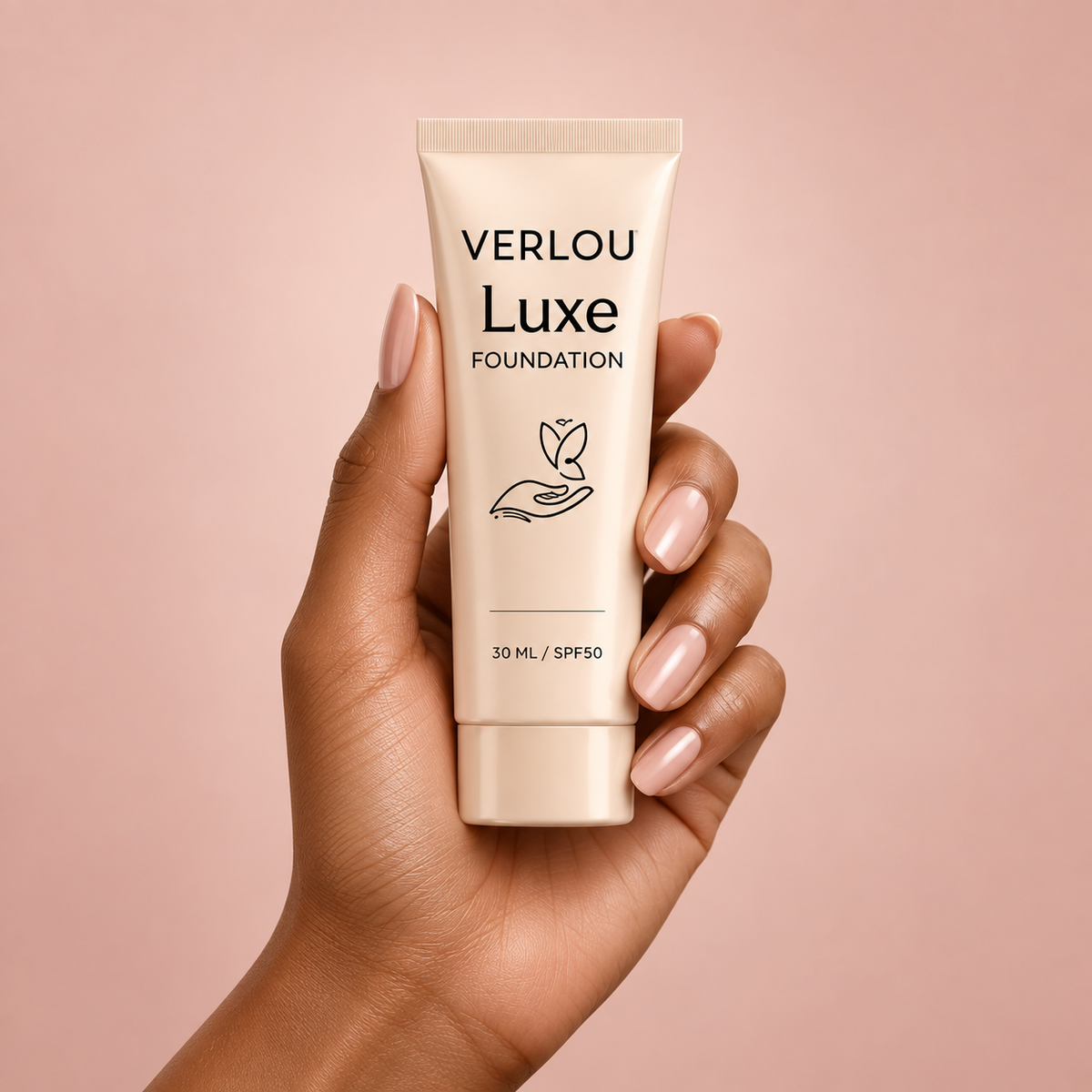 Verlou Luxe foundation held against a soft rose background